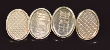 A pair of 9ct gold cufflinks with engine turned and initial decoration, 7.4g