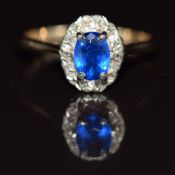 A 9ct gold ring set with a synthetic sapphire and diamonds, 2.7g, size P