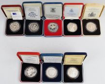 Seven Royal Mint cased silver crowns, most commemorative, all with certificates, together with a