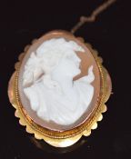 A 9ct gold brooch set with a cameo depicting a young woman