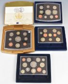 Four Royal Mint UK proof coin sets comprising 2000, 2002 executive, 2004 and 2007