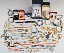 A collection of rolled gold including earrings, locket, two rings and a bangle, coral necklace and