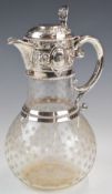Victorian hallmarked silver and cut glass claret jug with embossed decoration and hinged lid, the