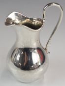 Russian silver jug of bulbous form, with 84 grade silver and St. Petersburg assay marks, height