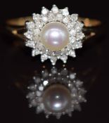 A 9ct gold ring set with a pearl surrounded by diamonds, 2.4g, size P