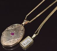 A 9ct gold locket set with a ruby on a 9ct gold chain, and a 9ct gold pendant set with three