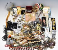 A collection of costume jewellery including hat pins and trinket boxes including necklaces, bangles,