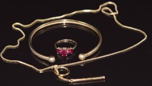 A 9ct bangle, 9ct gold necklace and 9ct gold ring set with rubies, 8.5g