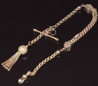A c1900 9ct gold / rolled gold watch chain made up of faceted sphere links, ridged links and