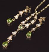 A 9ct gold necklace set with peridot and seed pearls and a pair of matching 9ct gold earrings, 5.9g