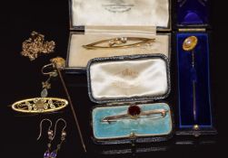A 9ct gold stick pin set with a gold nugget, 9ct gold stick pin set with a pearl in antique box,