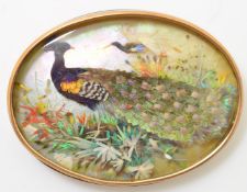 Oval feather mosaic of a peacock, possibly Chinese kingfisher wing, in rolled gold frame, width 6.