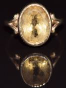 A 9ct gold ring set with an oval cut citrine, 4.8g, size N