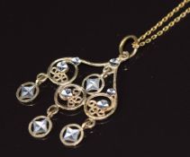 A 9ct gold pendant with cut out and pierced decoration, on 9ct gold chain, 1.9g