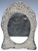 Edward VII or George V hallmarked silver dressing table mirror with oval bevelled glass and easel