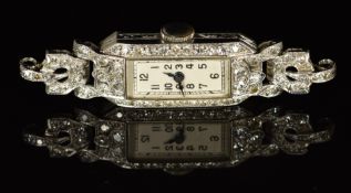 Art Deco diamond set platinum ladies wristwatch with blued hands, black Arabic numerals, silver