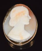 A 9ct gold brooch set with a cameo depicting a young woman, signed J. Saulini