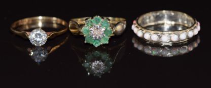 A 9ct gold ring set with cubic zirconia (1.4g, size Q), a 9ct gold and silver eternity ring set with