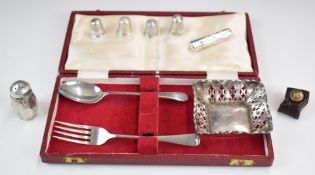 Hallmarked silver and white metal items comprising pierced bon bon dish, four thimbles, needle or