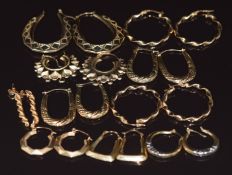 Ten pairs of 9ct gold earrings comprising nine pairs of hoops and one rope twist, 14g