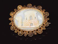 A 19thC filigree brooch set with a cameo depicting a building 1.7g 2.8x2.5cm