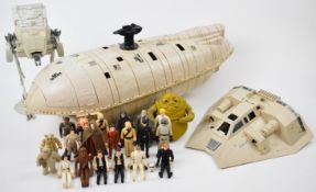 A collection of vintage Star Wars figures and vehicles to include Rebel Transporter, AT-ST, Snow
