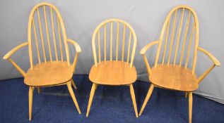 Three Ercol light elm chairs including two carvers