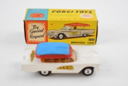Corgi Toys diecast model Bermuda Taxi with white body, blue and red canopy, yellow interior and