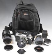 Minolta XE-1 35mm SLR camera outfit including Minolta MC Rokkor 58mm 1:1.2, Vivitar 28mm 1:2.5 and