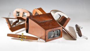 Four various Victorian and later stereoscopic viewers, one with aluminium shields and marked