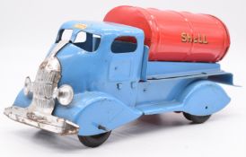 Tri-ang Shell Motor Oil friction powered tanker truck with blue body, red tank and chrome grille,