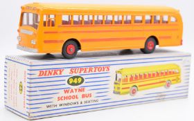 Dinky Supertoys diecast model Wayne School Bus with yellow body, red trim, red hubs and interior,