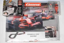 Carrera Evolutions Scalextric style 'Formula One' racing set, 25152, together with Electronic Lap