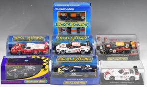 Eight Scalextric model slot racing cars comprising six individual and one twin car set. Models