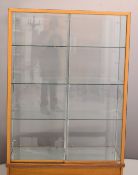Haberdashery shop fitting glazed display cabinet with oak frame, adjustable glass shelves and