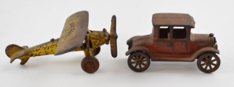 Kenton Toys, Ohio cast iron 'Air Mail' aeroplane and a similar Model T Ford (unmarked)