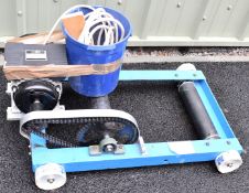 Motorcycle roller starter with mains powered electric motor, vendor's tag attached suggests it