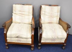 Pair of early 20thC bergere armchairs with carved ball and claw feet and arms