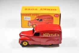 Dinky Toys diecast model Austin Van Nestlé with red body, yellow hubs and gold decals, 471, in