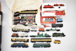 Four Hornby and Tri-ang 00 gauge locomotives together with a collection of carriages and rolling
