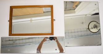 Three British Railways carriage, station or similar mirrors with logo to centre of each, largest