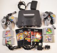 Nintendo N64 computer games console with two controllers, power supply and 4 games comprising