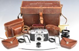 Agfa Karat 35mm bellows camera, together with two Proximeter cased Yashica lenses, all housed in a