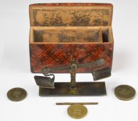 Novelty miniature coin balance or beam scales with three 1821 Royal Mint coin weights, housed in a