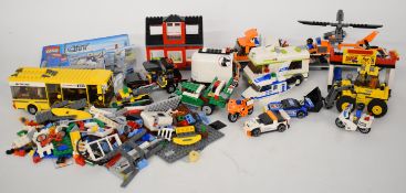 Twelve Lego City and Lego Creator sets including Helicopter Transporter 7686, Front End Loader 7630,