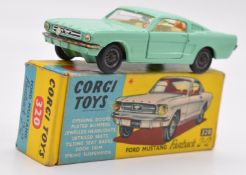 Corgi Toys diecast model Ford Mustang Fastback 2+2 with mint green body, cream interior and corgi on