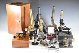 Five various microscopes and various accessories to include C.Baker London example in carry case,