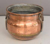 Eastern hammered copper vessel with wrought iron mounts and handles, diameter 40 x height 32cm