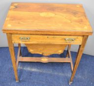 19thC inlaid rosewood games and work table, the fold over top having chess and backgammon boards,