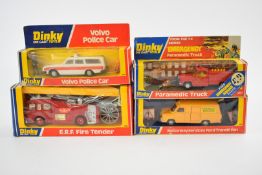 Four Dinky Toys diecast model vehicles Volvo Police Car 243, ERF Fire Tender 266, Paramedic Truck
